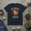 Pitbull Dad t-shirt design featuring text "PITBULL DAD" and a graphic of a pitbull inside a shield