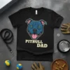 Black t-shirt with a blue pitbull face graphic and "PITBULL DAD" text, featuring a happy dog expression