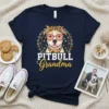 Pitbull Grandma t-shirt with a graphic of a smiling pitbull wearing sunglasses and a bandana, surrounded by sunflowers and paw
