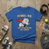 Pitbull Kid Like A Regular Kid But Cooler t-shirt design featuring a pitbull with a red cape and bold text