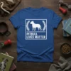 Blue t-shirt with white text "PITBULL LIVES MATTER" and a white silhouette of a pitbull inside a laurel wreath border
