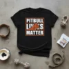 Black t-shirt with white text reading "PITBULL LIVES MATTER" and an illustration of a pitbull's head with a heart