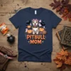 Pitbull Mom Halloween T-Shirt featuring a cute pitbull on a broomstick with pumpkins and ghosts