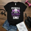 Black t-shirt with "Pitbull Mom With Tattoos Pretty Eyes" text and pitbull graphic