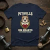Pitbulls Big Hearts In A Strong Package t-shirt design with a pitbull head, gold chain, and red heart graphic