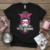 T-shirt with the text "Rocking the Pittie Grandma life" in white, featuring a graphic of a woman with a bandana