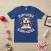Sloppy Kisser T-Shirt with a winking pitbull design, surrounded by pink hearts. Features white text "SLOPPY KISSER" above and below