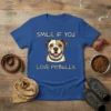 Blue t-shirt with white text "SMILE IF YOU LOVE PITBULLS" and a cartoon Pitbull dog illustration