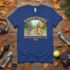 T-shirt with "Sometimes Motivation Finds You You" text and a cartoon dog pulling shoes on a path
