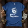 The Dogfather t-shirt design with a pitbull wearing a fedora and smoking a cigar, text below reads "The Dogfather"