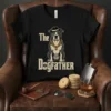The Dogfather t-shirt design featuring a stylized bulldog wearing a hat and monocle with a gold chain