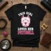 Black t-shirt with "This Girl Loves Her Pitbull" text and a pitbull head graphic in white and pink