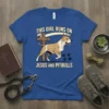 This Girl Runs On Jesus And Pitbulls text design with a pitbull graphic and cross, on a royal blue t-shirt