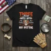 Black t-shirt with bold orange text "THREE Things MESS WITH My Family My Freedom MY PITTIE" and a pitbull graphic
