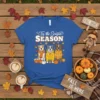 Tis the Season SEASON t-shirt design with three pitbull dogs wearing fall outfits and pumpkins, surrounded by autumn leaves