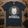 Pitbull graphic t-shirt with text "Your Ignance Is A Lot More Dangerous Than My Pitbull" and gear accents