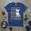 Blue t-shirt with orange and white text "YOU'RE LUCKY I'm Here I Could've Stayed Home With My PITBULL" and a